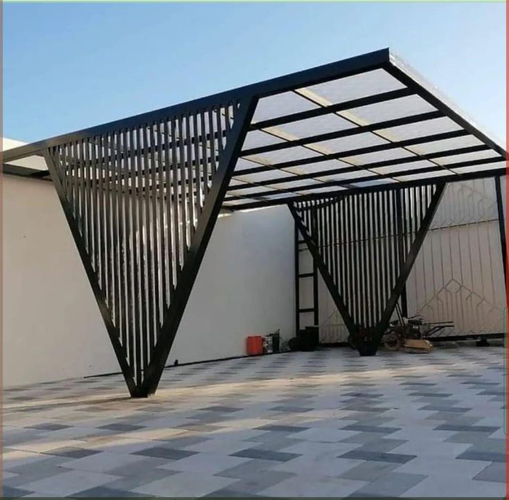 Steel carport canopy with vertical slat side screens and translucent roof panels