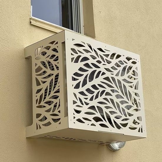 Decorative laser-cut metal cover enclosing an external air conditioning condenser unit