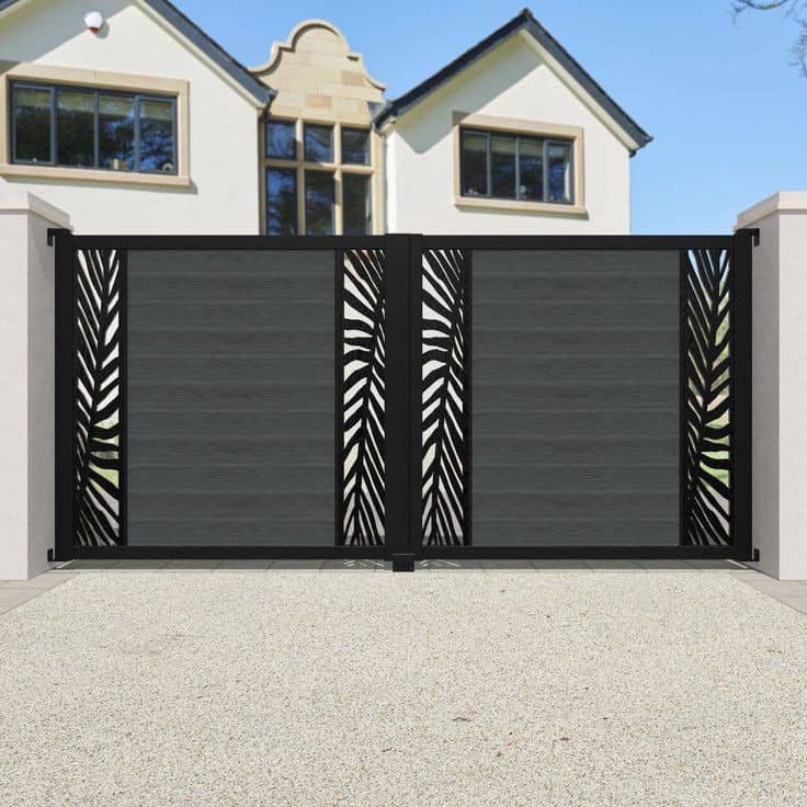 Dark sliding gate with laser-cut leaf pattern insert panels