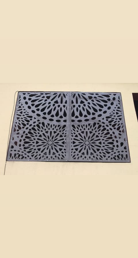 Flat laser-cut decorative metal panel with intricate pattern