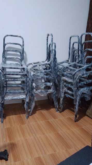 Stackable steel-frame chairs produced in batch