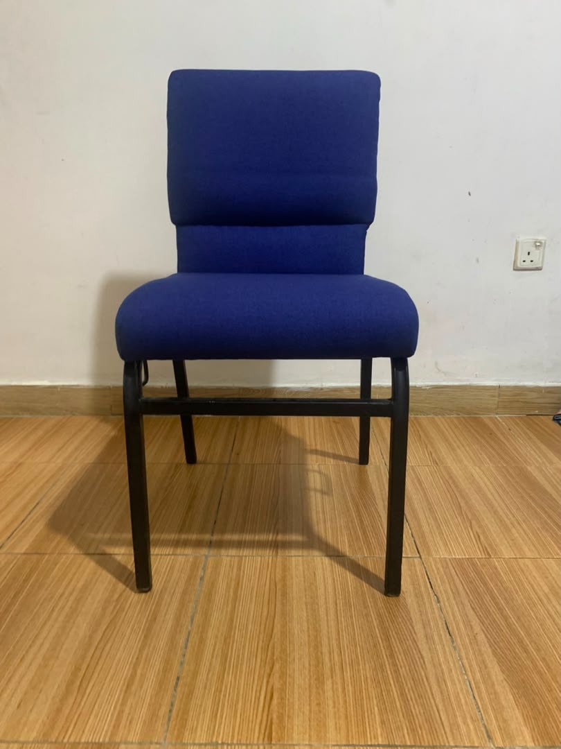 Blue upholstered chair on a black steel frame