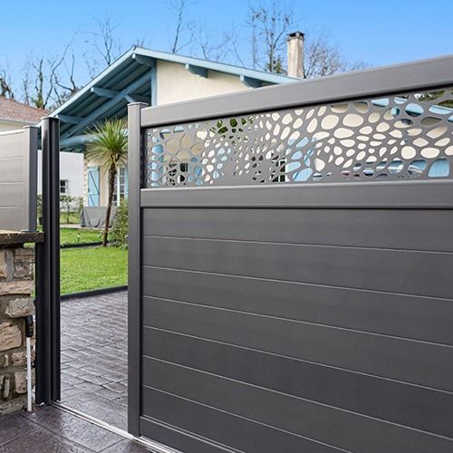 Metal gate with a laser-cut decorative side panel, shown open