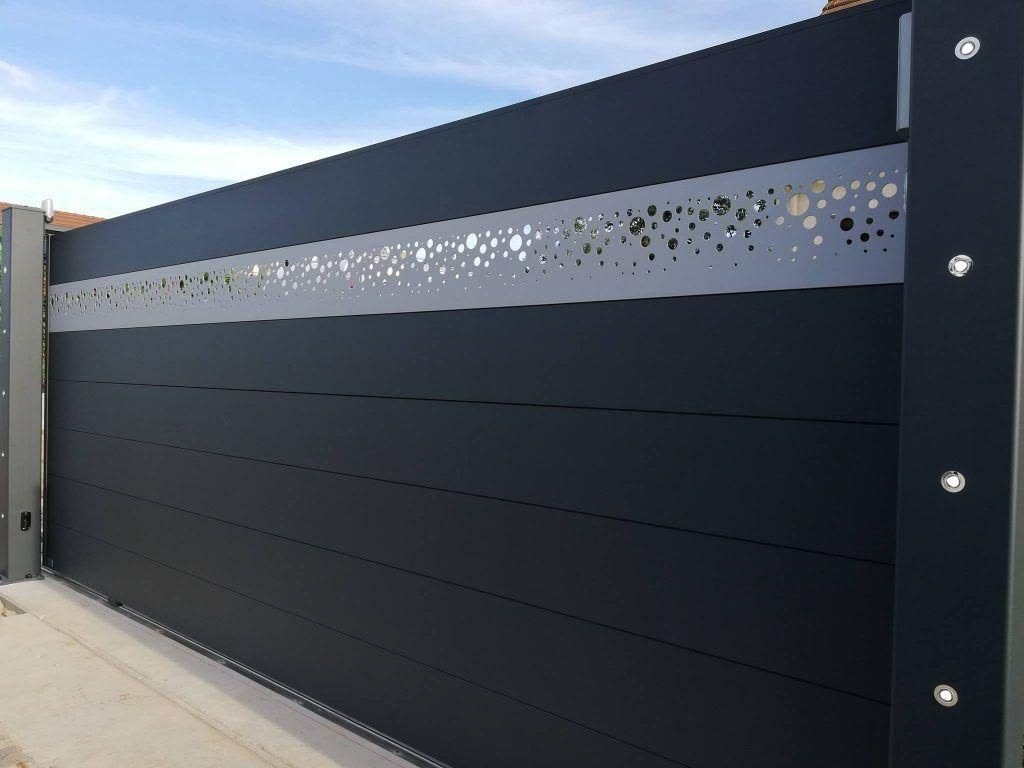 Contemporary sliding gate with a perforated laser-cut feature band